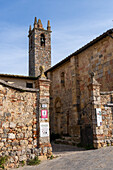 The Church of Santa Maria Assunta or Church of Saint Mary in the walled medieval town of Monteriggioni, Italy.