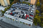 Aerial view of parked vehicles on the rooftop of a Volkswagen car dealership