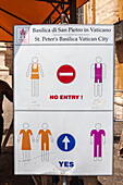 A sign at St. Peter's Basilica in Vatican City details the dress code for visitors to follow.