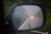 Blurry rearview mirror during a stormy day