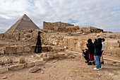 Tourists at the Great Pyramids complex, Giza, Egypt.