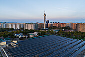 Aerial view of photovoltaic power station in Casablanca water treatment plant and Movistar Telecommunications tower, Zaragoza, Spain