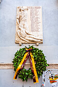 A memorial in Trastevere, Rome, remembers partisans who sacrificed their lives for liberation during 1943-1954.