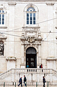 Lisbon, Portugal, March 1 2007, Visitors stroll in front of the beautiful Loreto Church, showcasing its elegant architecture in the heart of Chiado, Lisbon.