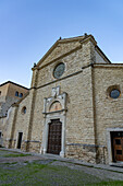 The church of the Benedictine Abbey of Santa Maria of Farfa, Italy with a carved Romanesque doorway.