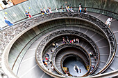 Rome, Italy, July 22 2017, Visitors descend the elegant helicoidal staircase at the Vatican Museums in Rome, showcasing stunning architectural design and detail.