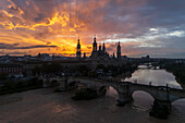 Aerial view of El Pilar Basilica Cathedral and the Ebro River at sunset, Zaragoza, Spain