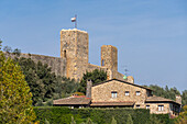 Watchtowers on the wall of the medieval town of Monteriggioni, Sienna, Tuscany, Italy. Viewed from outside.