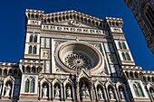 Detail of the ornate neo-Classical facade of the Duomo in Florence, Italy.