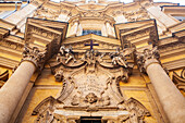 Admire the intricate rococo detailing of the Maddalena Church facade, showcasing artistry and architectural beauty in Rome.