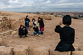 Tourists at the Great Pyramids complex, Giza, Egypt.