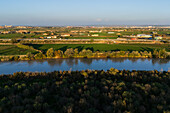 Aerial view of the Ebro River passing by La Alfranca area in Zaragoza, Spain