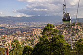 The famous metro system in Medellin, Colombia.includes elevated traiins, street level trains and even aerial cable cars to connectthe city's downtown to the poorer neighborhoods in the surrounding mountains.