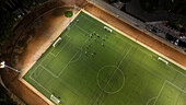 Aerial view of a training in a soccer field at night