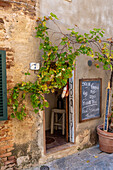 A small restaurant in the medieval walled town of Monteriggioni, Sienna Province, Italy.