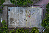 Basketball and soccer exterior courts among trees in city park, Zaragoza, Spain