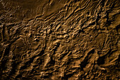 Aerial night view of an abundant Ebro River passing under the Stone Bridge after the Dana, Zaragoza, Spain