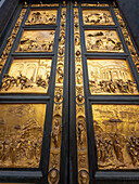 Biblical scenes on the Gates of Paradise or East Doors of Saint John's Baptistery in Florence, Italy.