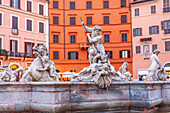 The stunning Neptune fountain stands majestically at Navona Square, captivating visitors with its intricate sculptures in the twilight.