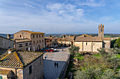 The Piazza Roma & church in the medieval walled town of Monteriggioni, Sienna Province, Italy.