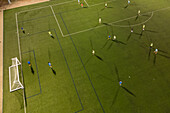 Aerial view of a training in a soccer field at night