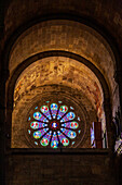 Lisbon, Portugal, March 1 2007, Beautiful stained glass window inside Se Cathedral in Lisbon, Portugal, showcasing intricate designs and vibrant colors, emphasizing the architectural beauty and historical significance of the cathedral.