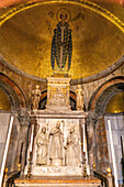 Bas relief sculptures and gold mosaics in St. Clement's Chapel in St. Mark's Basilica in Venice, Italy.