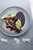 Grilled lamb belly and pointed cabbage with red wine sauce