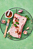 Marinated pork belly on barbecue grill