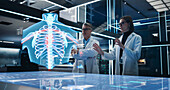 Bioengineers working with human chest hologram