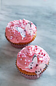 Cupcakes with pink buttercream and butterfly decoration