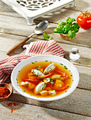 Tomato broth with cream cheese dumplings and chicken breast fillet