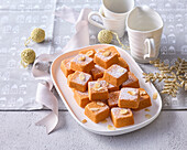 Christmas carrot cake bites with almonds and icing sugar