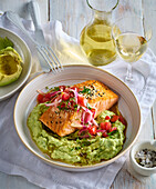 Honey-glazed salmon with avocado cream and tomato salsa