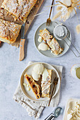 Apple strudel made from puff pastry with vanilla ice cream and vanilla sauce