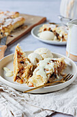 Apple strudel made from puff pastry with vanilla ice cream and vanilla sauce
