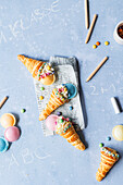 Puff pastry school cone with cream and sweets