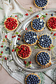 Pistachio tartlets with blueberries and wild strawberries