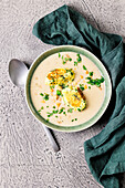 Garlic cream soup with chickpeas and herb dumplings