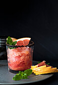 Grapefruit slush with black salt rim