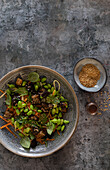 Edamame and aubergine salad with sesame seeds and herbs