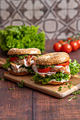 Sesame bagels with turkey breast, lettuce and tomatoes