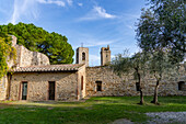 The cathedral bell tower, Torre Grossa & the ruins of a medieval fort in the walled town of San Gimignano, Italy. The ruins enclose the Parco della Rocca.