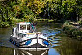 Nice landscape in the Canal du Midi near L'écluse de Marseillette South of France southern waterway waterways holidaymakers queue for a boat trip on the river, France, Europe