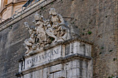 Statues over the entrance to the Vatican Museums in the city wall of the Vatican City in Rome, Italy.