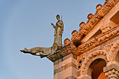 One of the four Evangelists on the corner of the west facade of the Pisa Cathedral. Pisa, Italy.