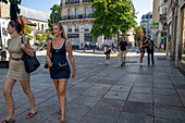 Teenage girls walking near Abbaye de Saint-Germain-des-Prés church Paris France