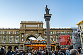 The Column of Abundance in the Piazza della Repubblica or Republic Square in Florence, Italy. Behind is the Palazzo dell'Arcone di Piazza.