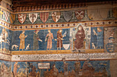 Medieval frescoes in the Sala di Dante of the 13th Century Palazzo Comunale or city hall in San Gimignano, Italy.