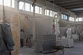 Marble dust in the air in a marble carving studio in Carrara, Italy.